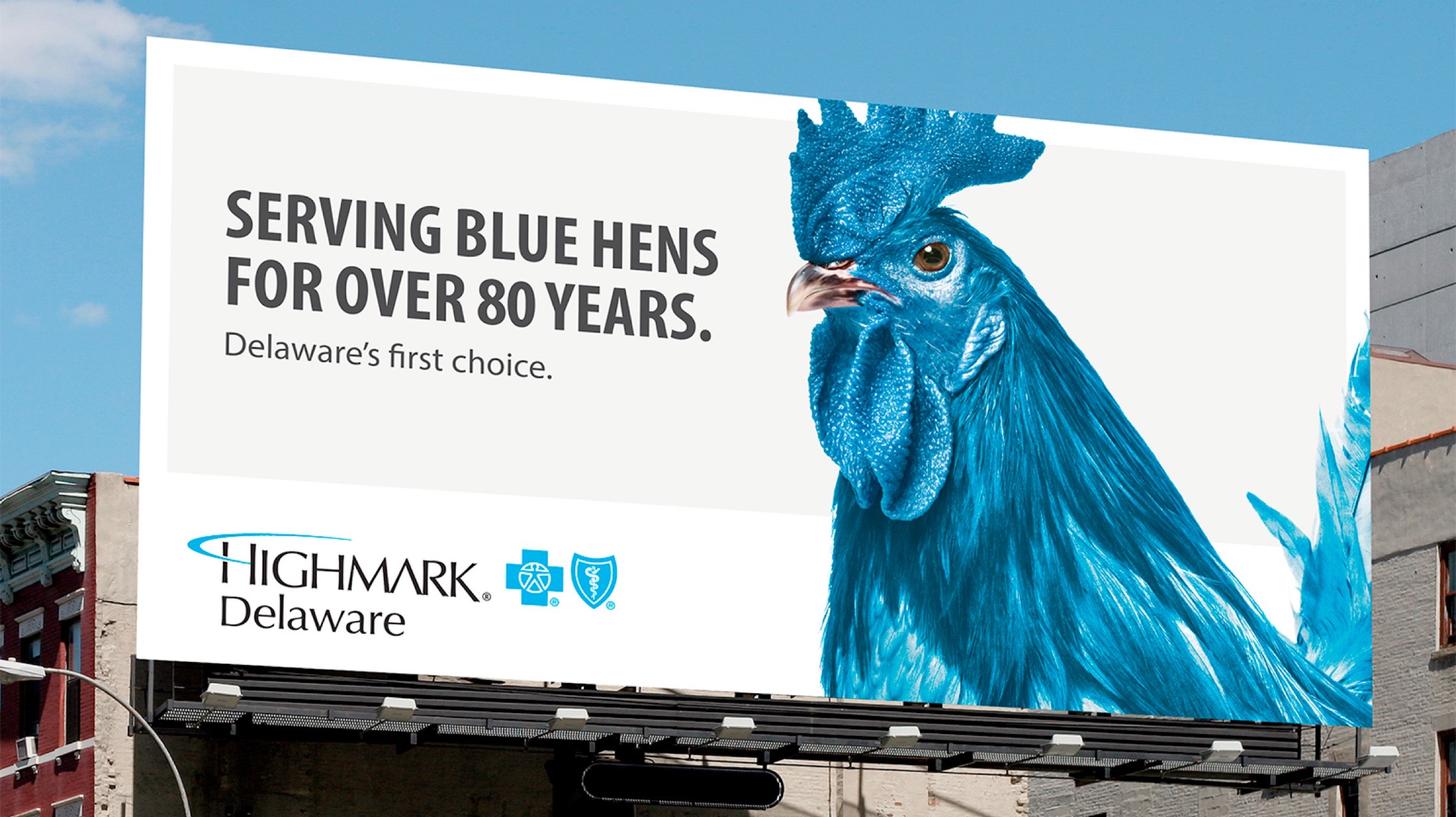 Photograph of a blue hen billboard.