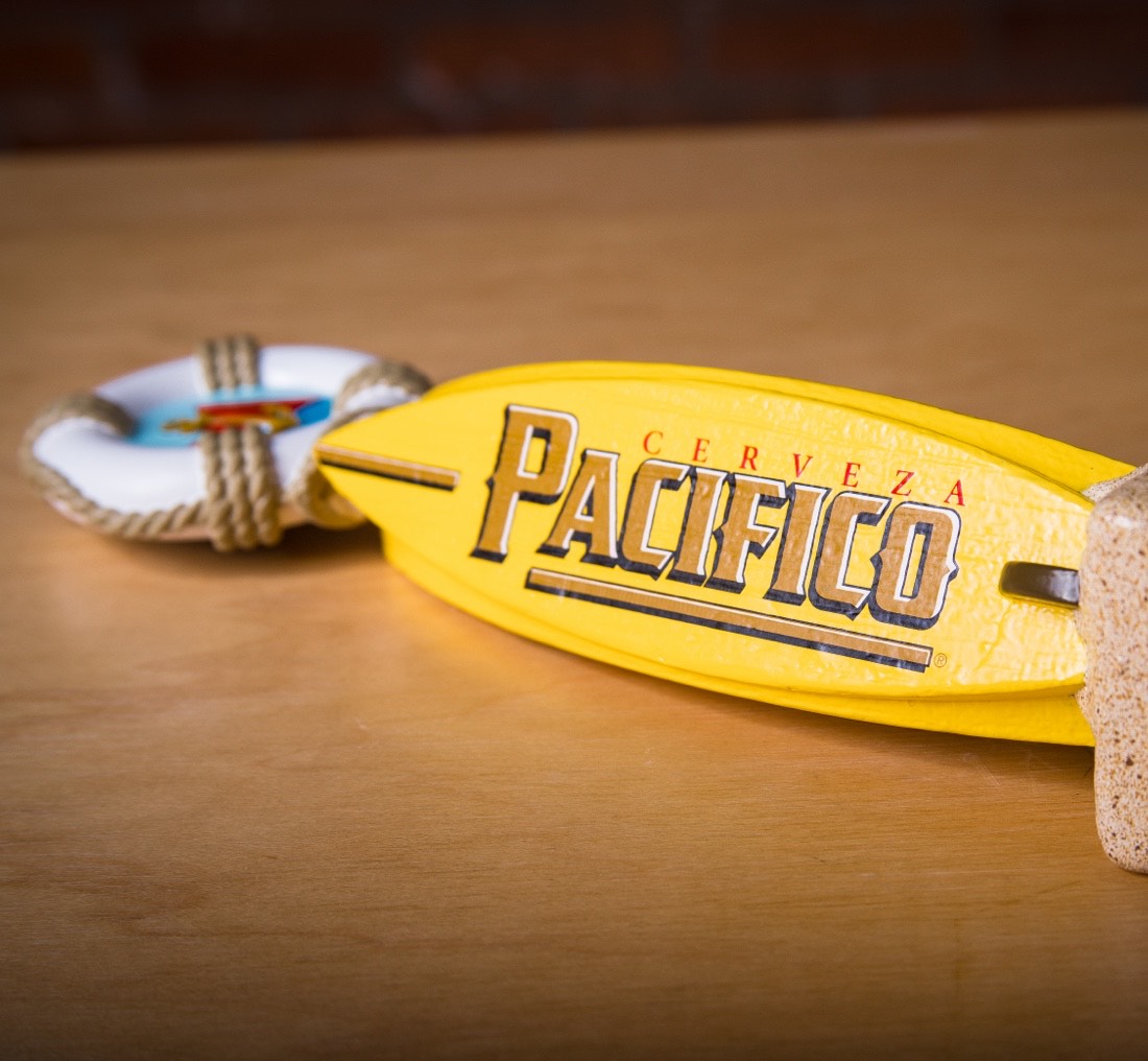 Photograph of a Pacifico surfboard bottle opener.