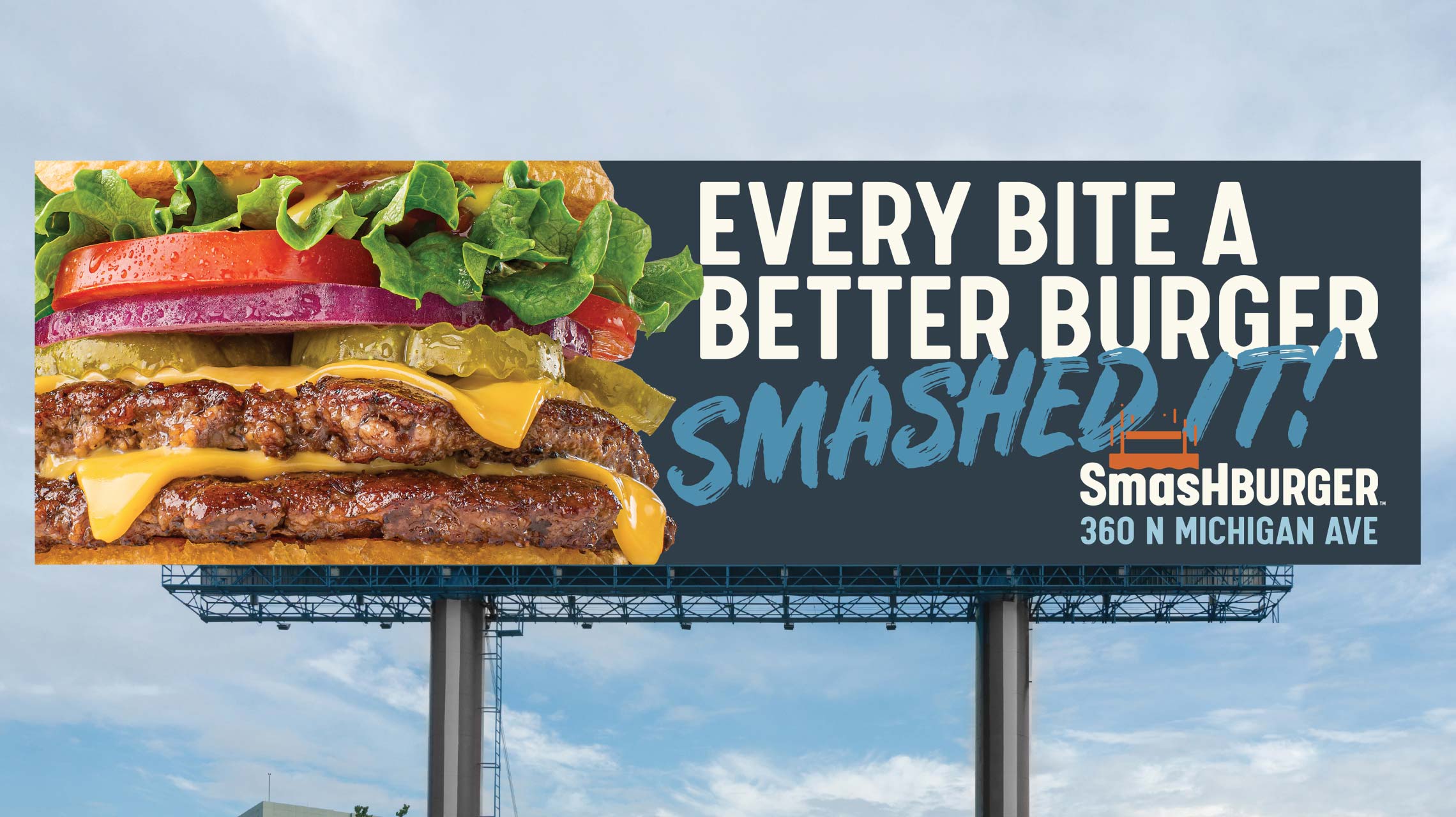 Photograph of a Smashburger billboard - "Every bite a better burger!"